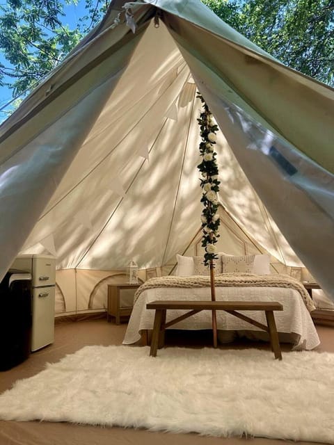 Peaceful Glamping Tents with Elevated Decks, Cozy Fire Pit, and Secluded Forest Views Near Gentry, AR Luxury tent in Arkansas