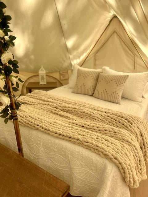 Peaceful Glamping Tents with Elevated Decks, Cozy Fire Pit, and Secluded Forest Views Near Gentry, AR Luxury tent in Arkansas