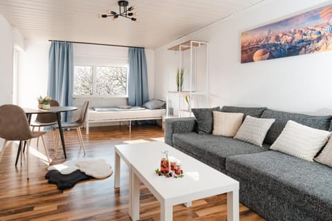 Bed, TV and multimedia, Living room, Seating area, Dining area