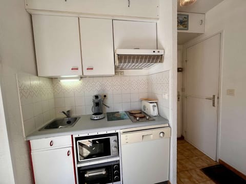 Kitchen or kitchenette, dishwasher, oven, stove, toaster