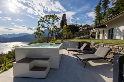 Property building, Lake view, Mountain view, Swimming pool, Sunset, sunbed