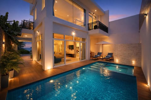 Property building, Patio, Night, Pool view, Swimming pool, Swimming pool, sunbed