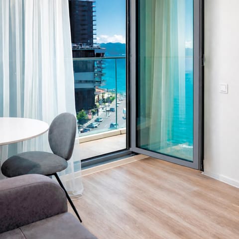 View (from property/room), Balcony/Terrace, Living room, Seating area, Sea view