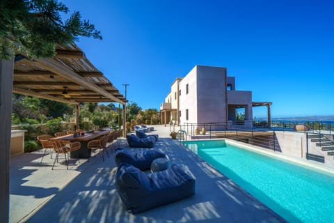Property building, Patio, Natural landscape, View (from property/room), Swimming pool, sunbed