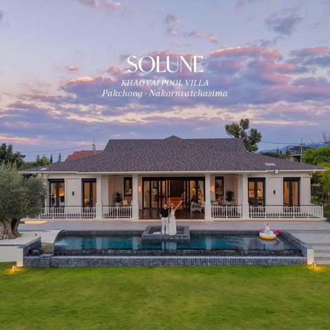 Property building, Patio, Day, Natural landscape, Garden, Text overlay, Garden view, Pool view, Swimming pool