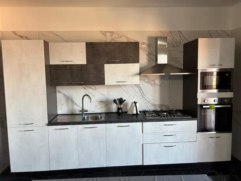 Kitchen or kitchenette, dishwasher, microwave, oven, washing machine, kitchen