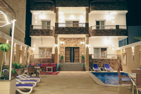 Night, Balcony/Terrace, Seating area, Pool view