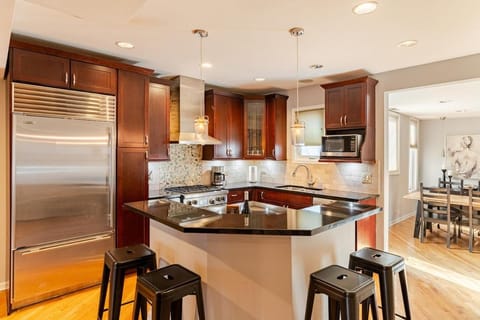 Kitchen or kitchenette, dishwasher, oven, stove