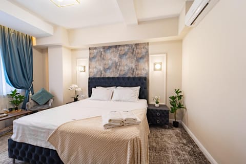 Bed, Photo of the whole room, Bedroom, towels, air conditioner