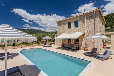 Patio, Day, Natural landscape, Pool view, Swimming pool, sunbed