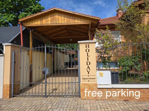 Property building, Property logo or sign, Text overlay, Parking