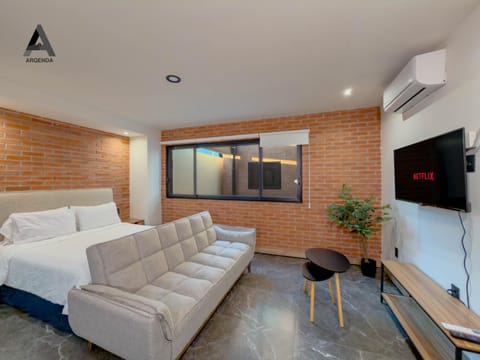 Communal lounge/ TV room, Bed, Living room, Seating area, Evening entertainment