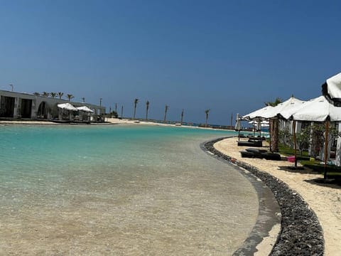 Property building, Nearby landmark, Day, Natural landscape, Beach, Sea view, Swimming pool