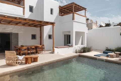 Property building, Patio, Day, View (from property/room), Seating area, Dining area, Pool view, Swimming pool