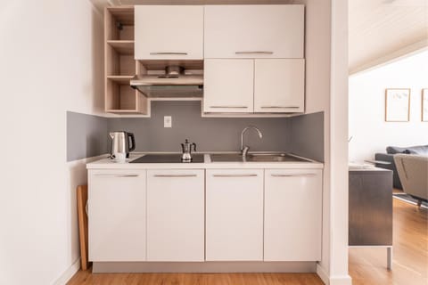 Kitchen or kitchenette, dishwasher, stove, washing machine
