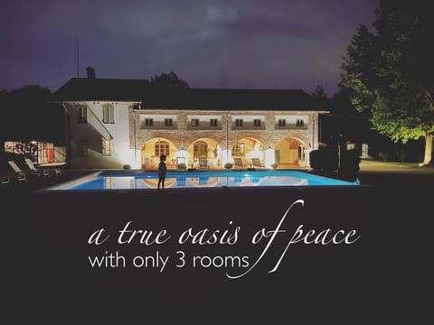Property building, Patio, Night, Natural landscape, Text overlay, Pool view, Swimming pool
