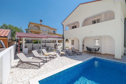 Property building, Seating area, Swimming pool