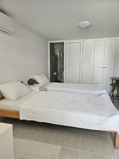 Bed, Bedroom, towels, wardrobe, air conditioner