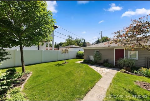 Downtown Naperville Retreat with King bed Near Riverwalk Dedicated Workspace Free Garage Parking Patio Apartment in Naperville