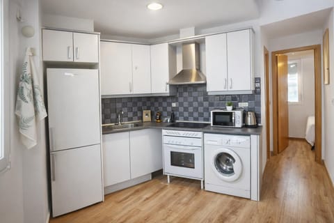 Kitchen or kitchenette, microwave, oven, stove, washing machine, kitchen