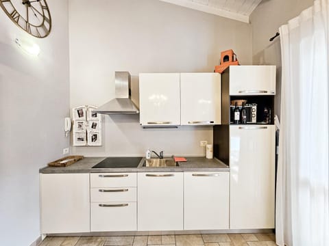Kitchen or kitchenette, dishwasher, oven, stove, toaster, washing machine