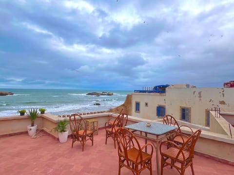 Property building, Nearby landmark, Day, Natural landscape, View (from property/room), Balcony/Terrace, Seating area, Beach, Sea view