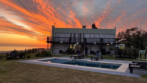 Property building, Natural landscape, Pool view, Swimming pool, Sunset, sunbed
