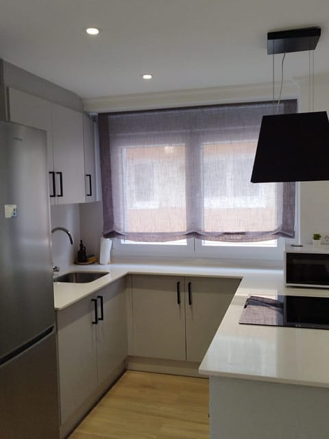 Kitchen or kitchenette, oven, stove