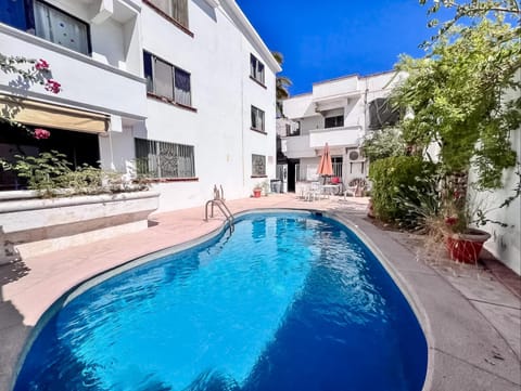 Property building, Patio, Day, Pool view, Swimming pool