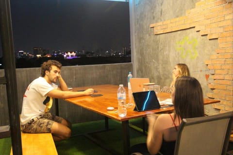 Property building, Night, People, Balcony/Terrace, Living room, Seating area, Guests, group of guests