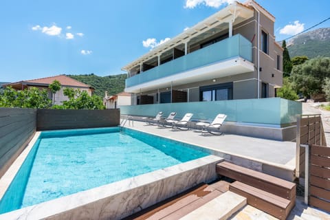 Property building, Natural landscape, Pool view, Swimming pool, sunbed