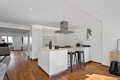 Kitchen or kitchenette, dishwasher, oven, stove