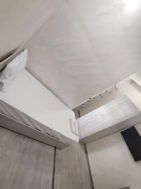 Bed, towels, wardrobe