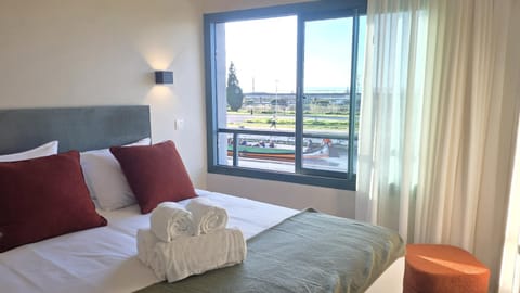 Bed, View (from property/room), Bedroom, River view, towels