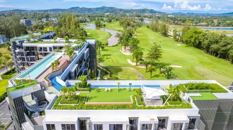 Property building, Natural landscape, Bird's eye view, Golfcourse, Swimming pool