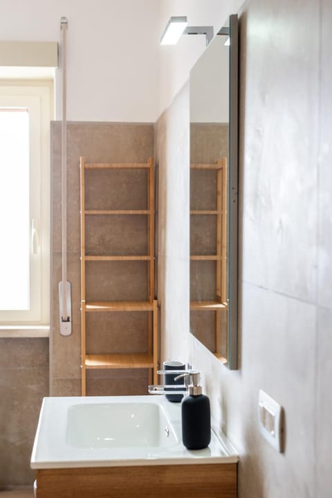 Shower, Toilet, Bathroom, Decorative detail, bidet, hair dryier, towels, elevator