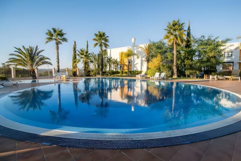 Property building, Living room, Swimming pool