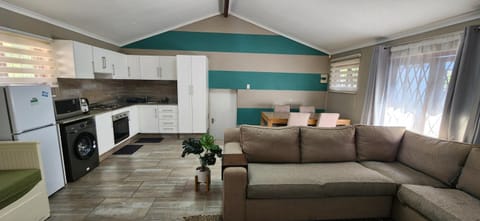 Kitchen or kitchenette, Living room, Seating area, Dining area, oven, stove, toaster