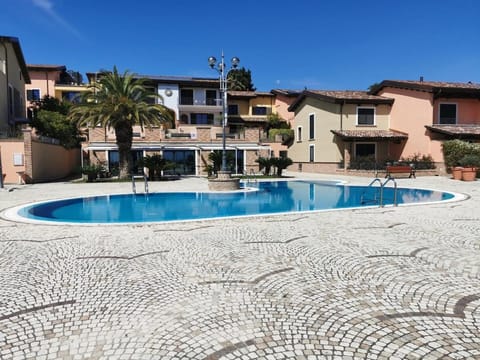 Property building, Day, Pool view, Swimming pool, sunbed