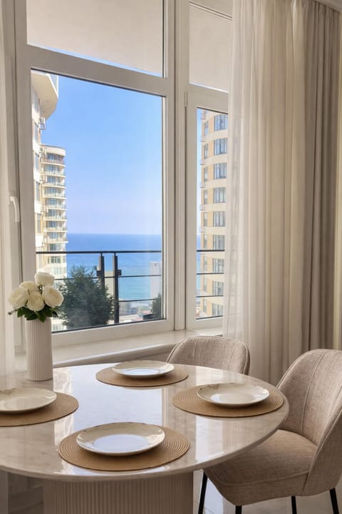 View (from property/room), Balcony/Terrace, Living room, Seating area, Dining area, Sea view