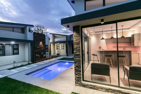 Property building, Communal lounge/ TV room, Evening entertainment, Pool view, Swimming pool