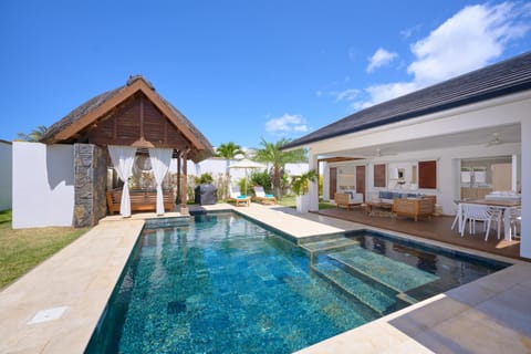 Property building, Patio, Pool view, Swimming pool, sunbed