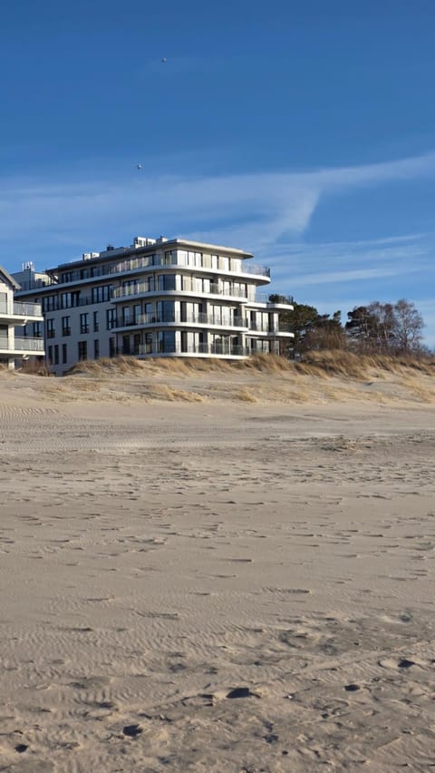 Property building, Nearby landmark, Day, Natural landscape, Beach