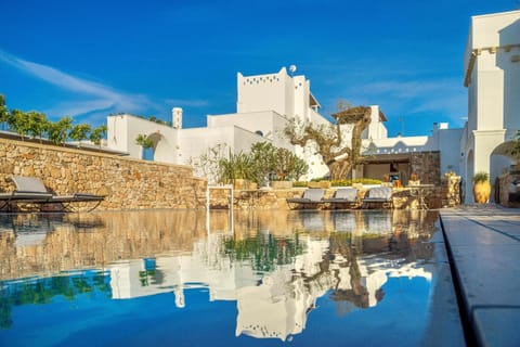 Property building, Nearby landmark, Day, Natural landscape, Pool view, Swimming pool
