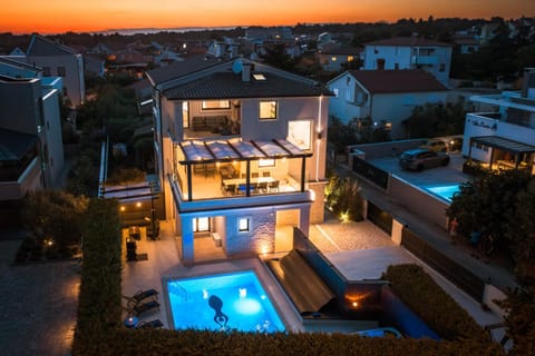 Property building, Patio, Night, Bird's eye view, Pool view, Swimming pool, Sunset, sunbed