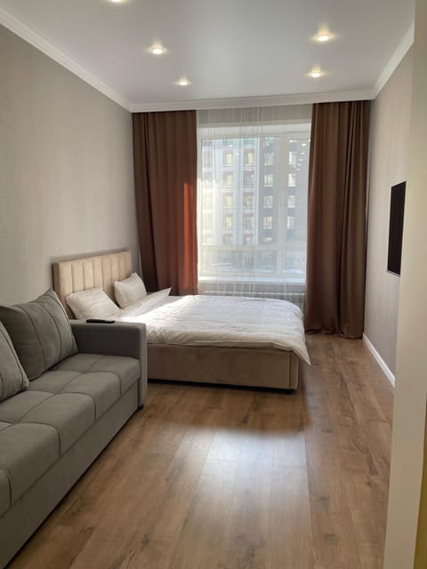 Bed, Living room, Seating area, Bedroom