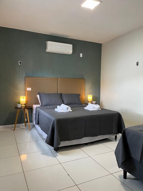 Bed, Photo of the whole room, Bedroom, towels, air conditioner