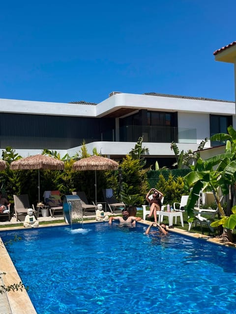 Property building, Day, Pool view, Swimming pool, sunbed