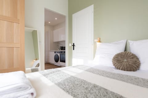 Bed, Bedroom, towels, wardrobe, washing machine