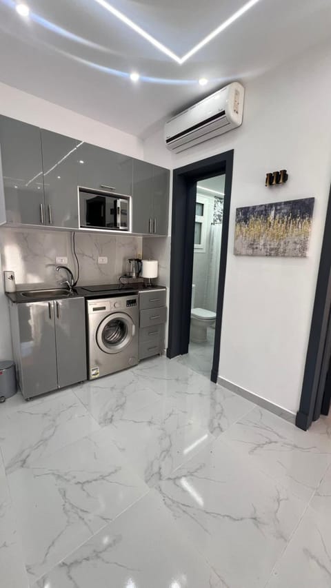 Kitchen or kitchenette, oven, stove, washing machine, air conditioner